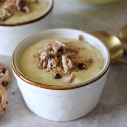 vanilla pudding ina small cup with crushed cookies on top