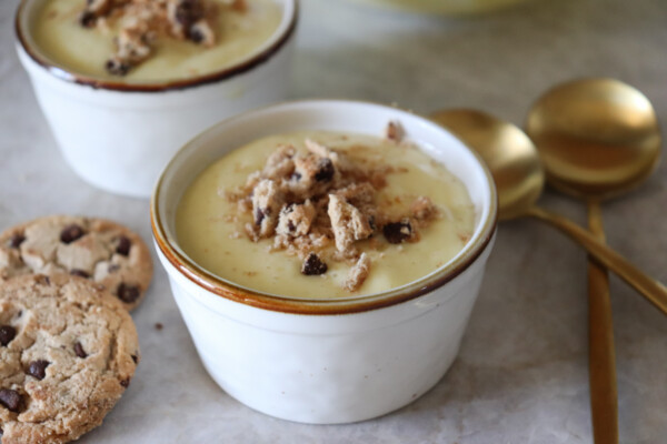 vanilla pudding ina small cup with crushed cookies on top
