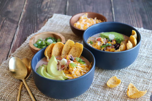 White chicken chili with Fritos, avocado, beans, corn, and green onions. #stayfitmom #chickenchili