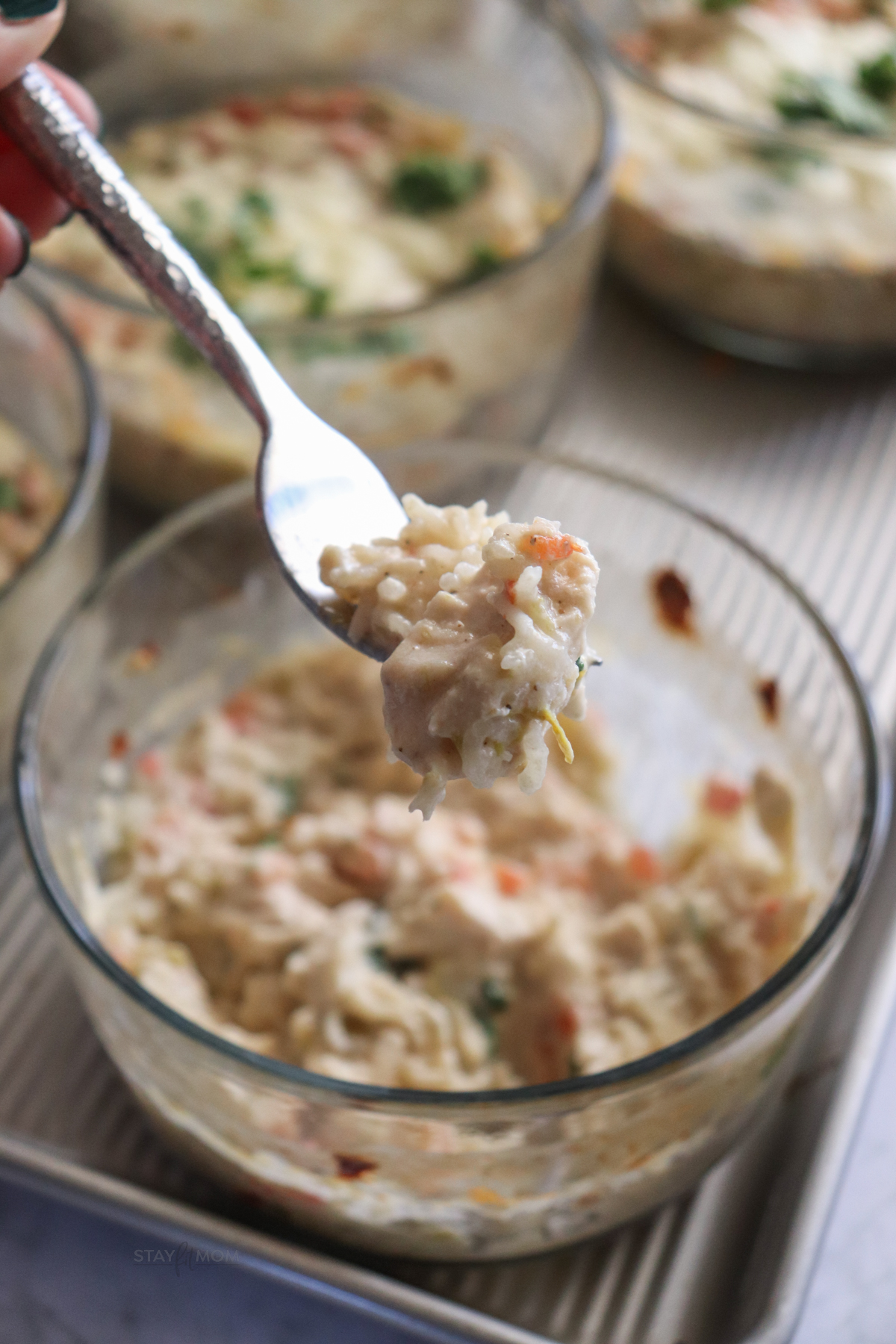 Green Chile Chicken Bakes showing chicken and rice in a creamy sauce.