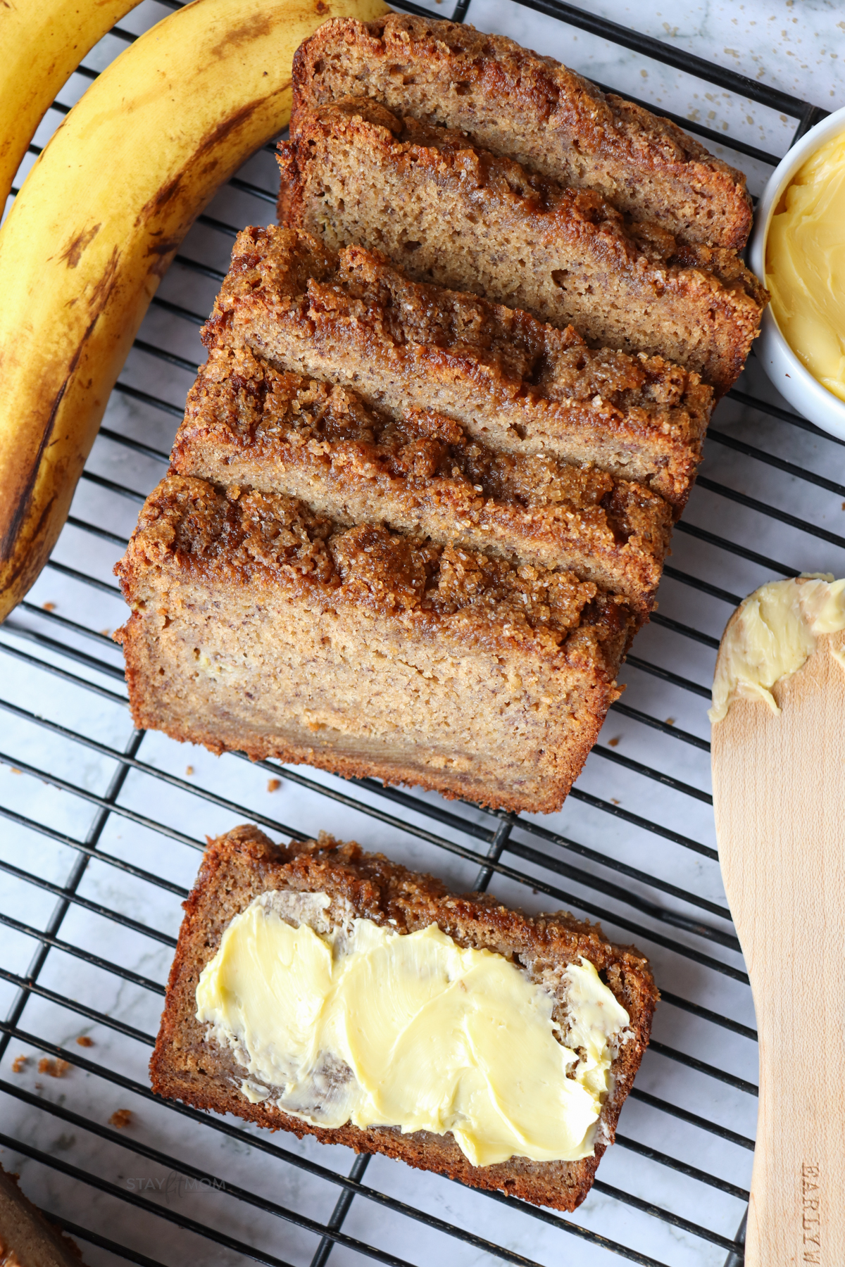 Banana Bread showing a slice spread with butter.