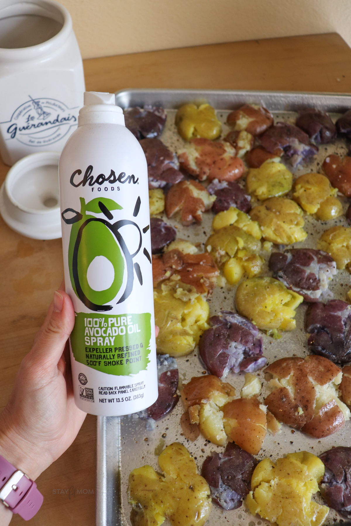 Can of Avocado Oil with garlic smashed potatoes in the background.