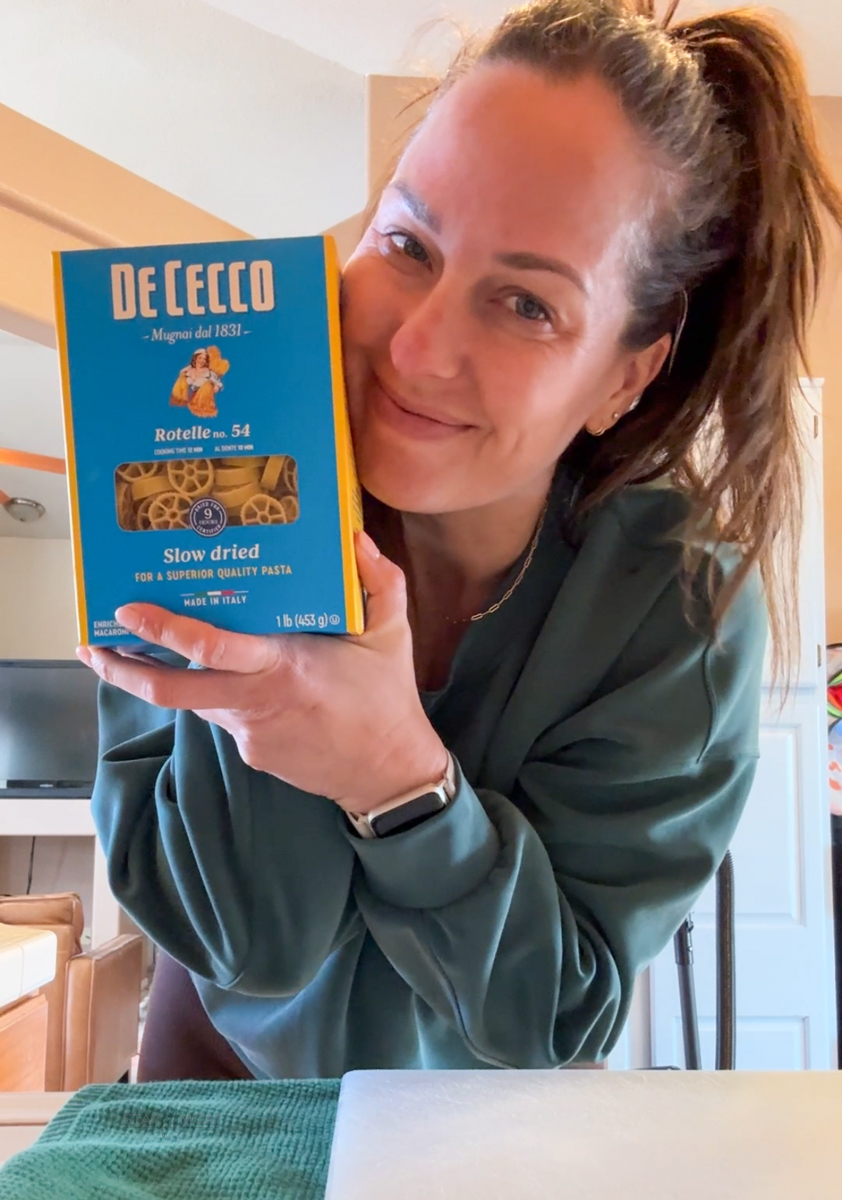 Image of Krista holding DeCecco pasta noodles.