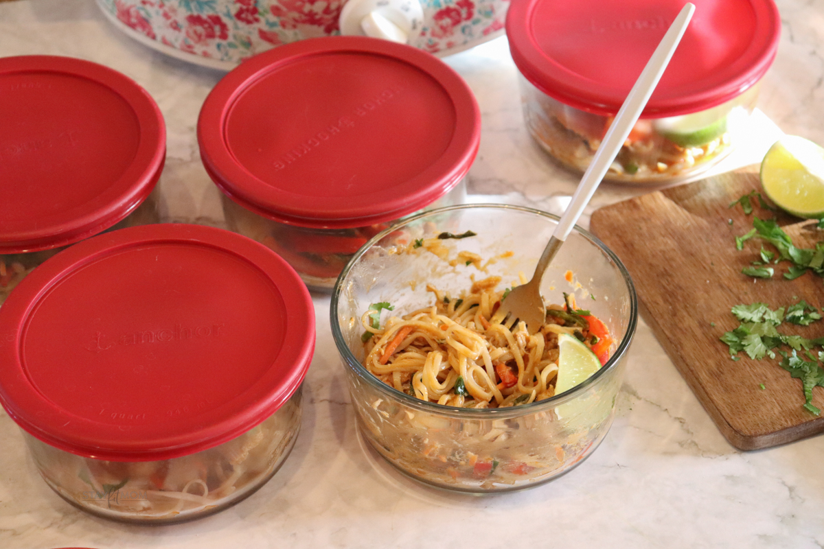 Peanut Noodle Bowls showing one bowl ready to eat and the other 4 with lids ready to be stored for lunches.
