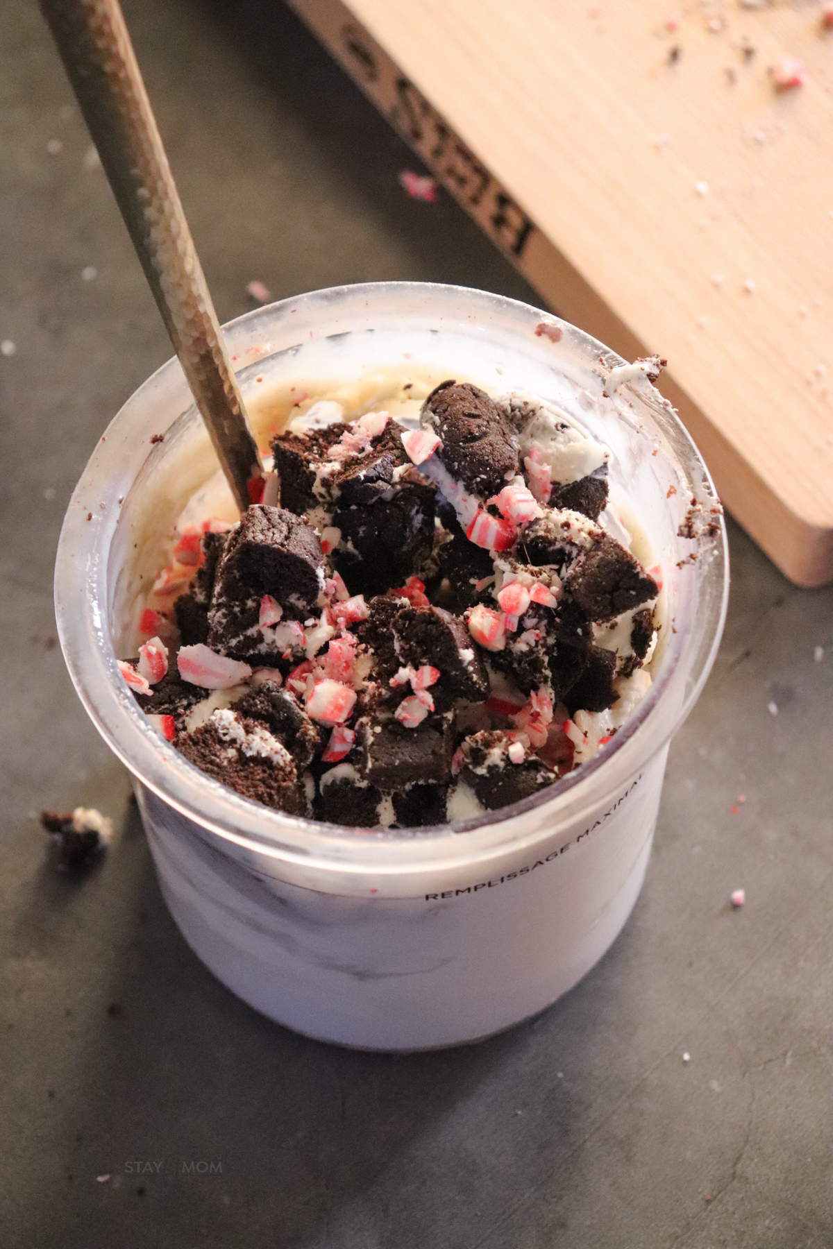 Peppermint Protein Creami shown in creami container topped with peppermint and oreo cakester crumbles.
