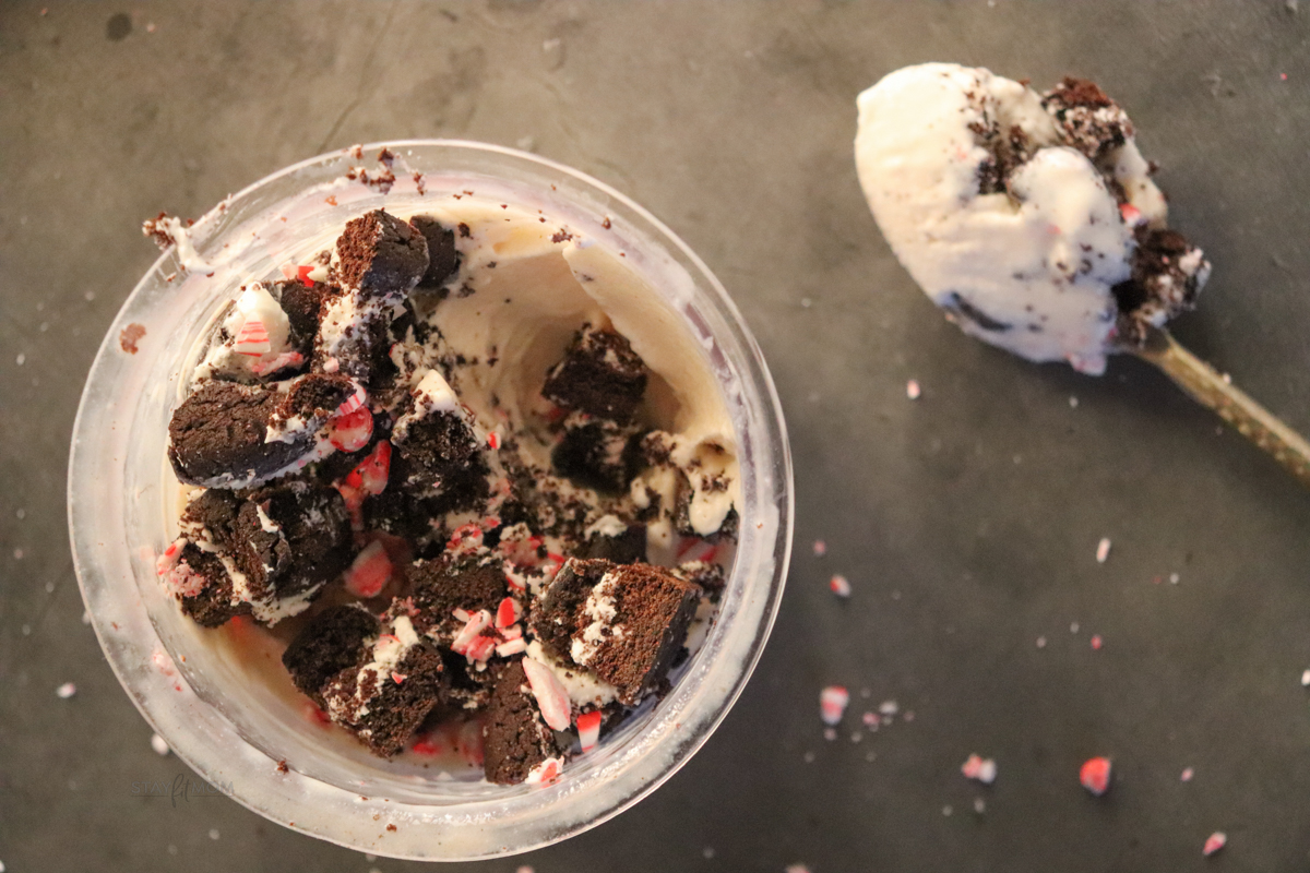 Peppermint Protein Creami shown in creami container topped with peppermint and oreo cakester crumbles.