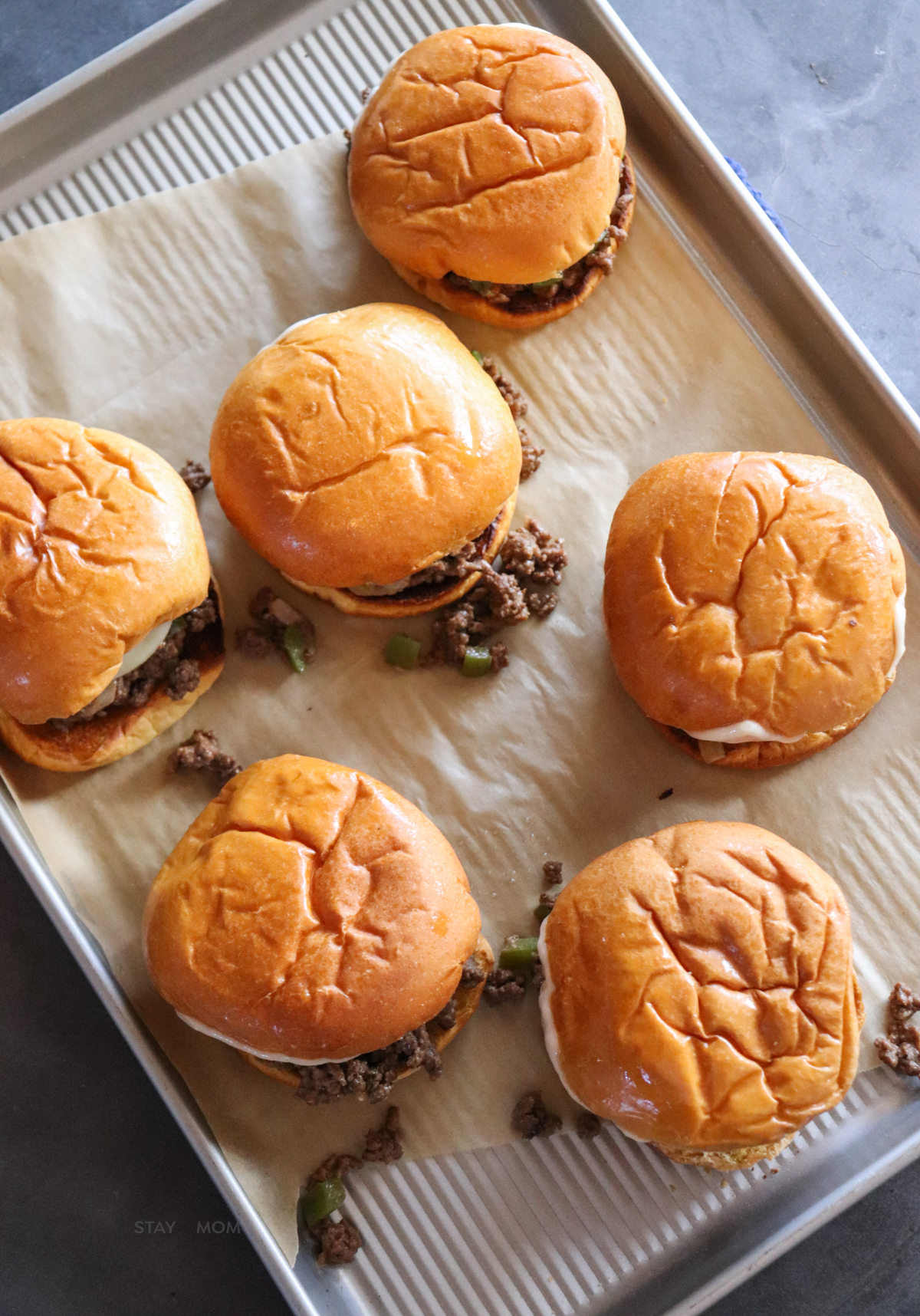 Philly Cheesesteak Sloppy Joes showing tray of completed sandwiches.