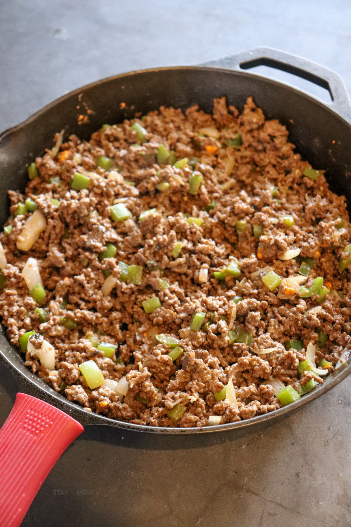 Philly Cheesesteak Sloppy Joes showing pan of ground beef mixture.