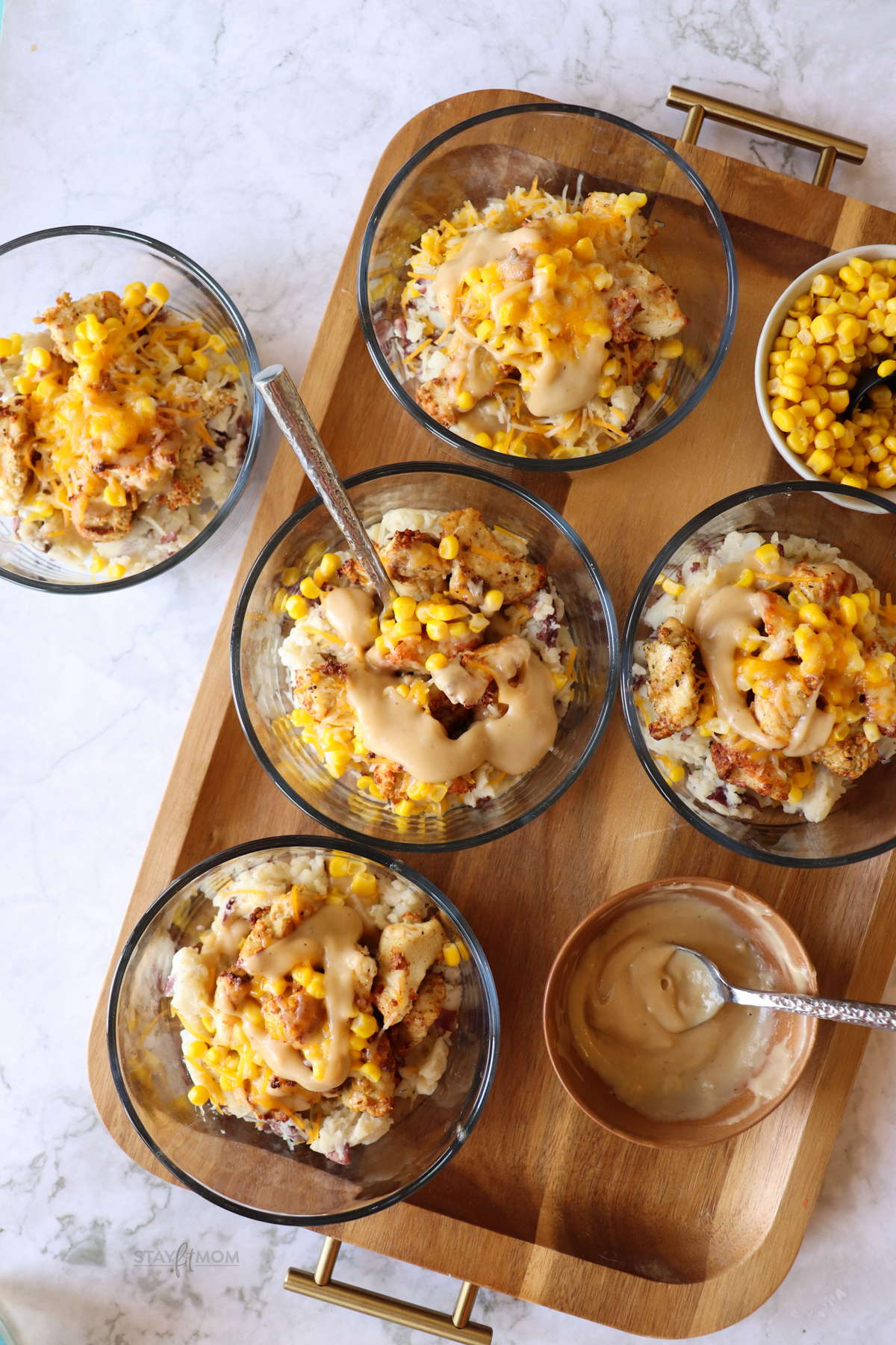 KFC Bowls showing completed bowls on a wooden tray.