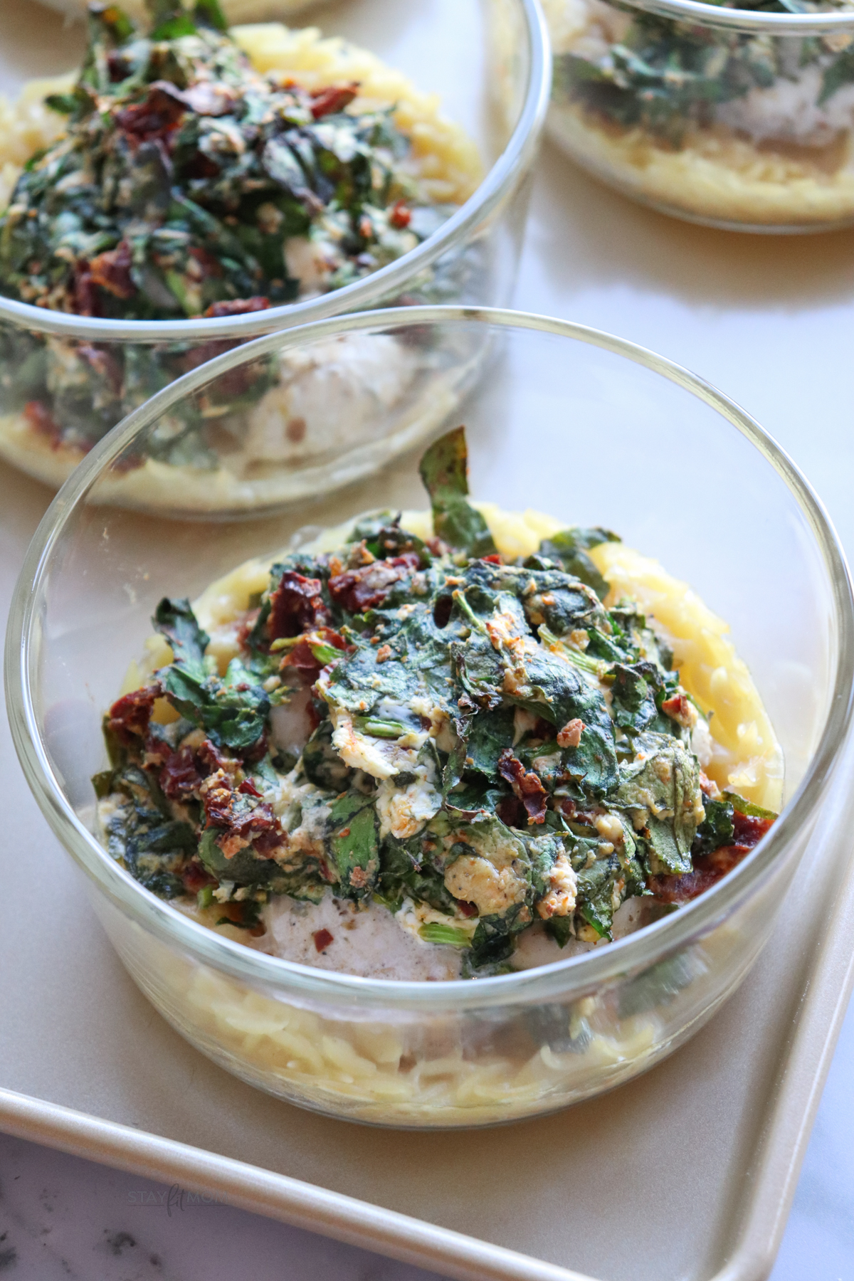 Sun Dried Chicken Orzo Easy Bakes showing completed meal with visible orzo, spinach, and sun dried tomatoes.