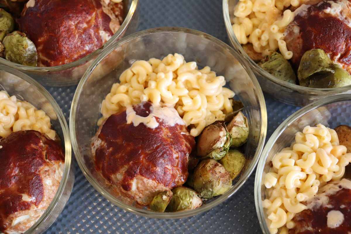BBQ Turkey Meatloaf Bowls showing completed meal prep with cooked meatball, brussels sprouts, and mac & cheese.