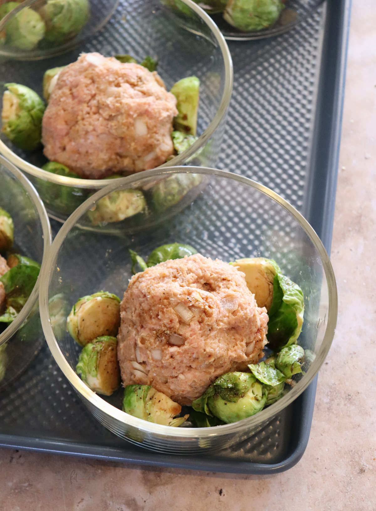 BBQ Turkey Meatloaf bowls showing meal prep bowls with meatball and brussels sprouts.