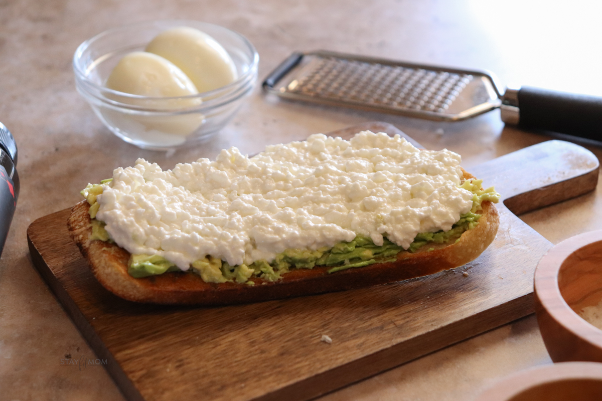 Sourdough toast with avocado and cottage cheese.