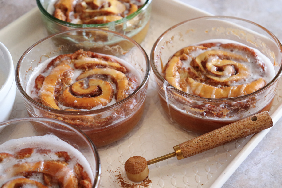 Cinnamon Roll Pancake Bowls baked and topped with glaze.