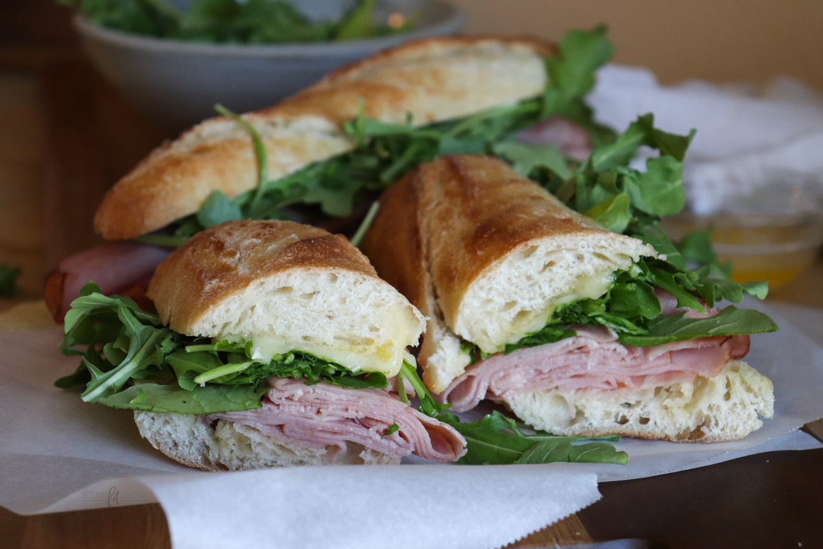 Ham & Cheese Baguettes showing sandwiches sliced.