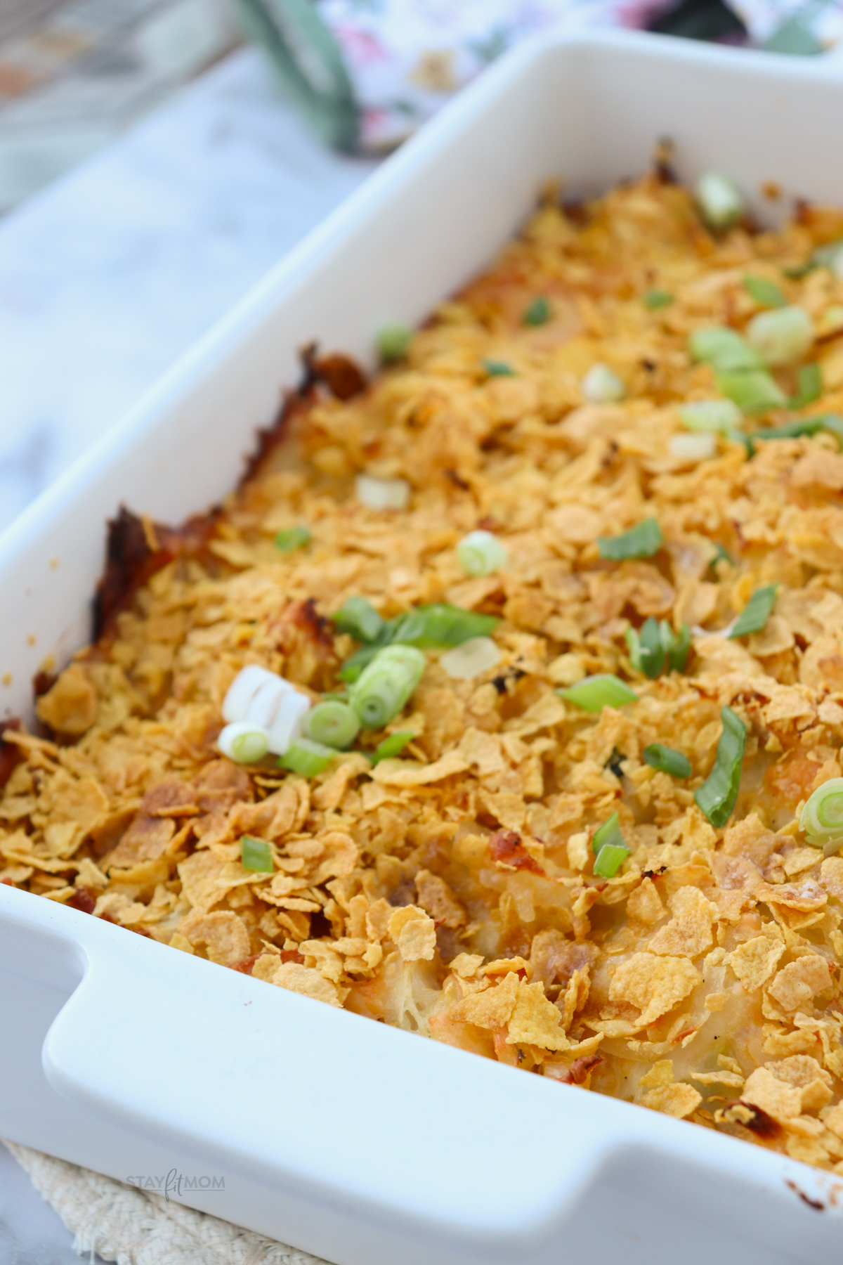 Party Potatoes showing completed recipe with crunchy corn flake topping and green onions.