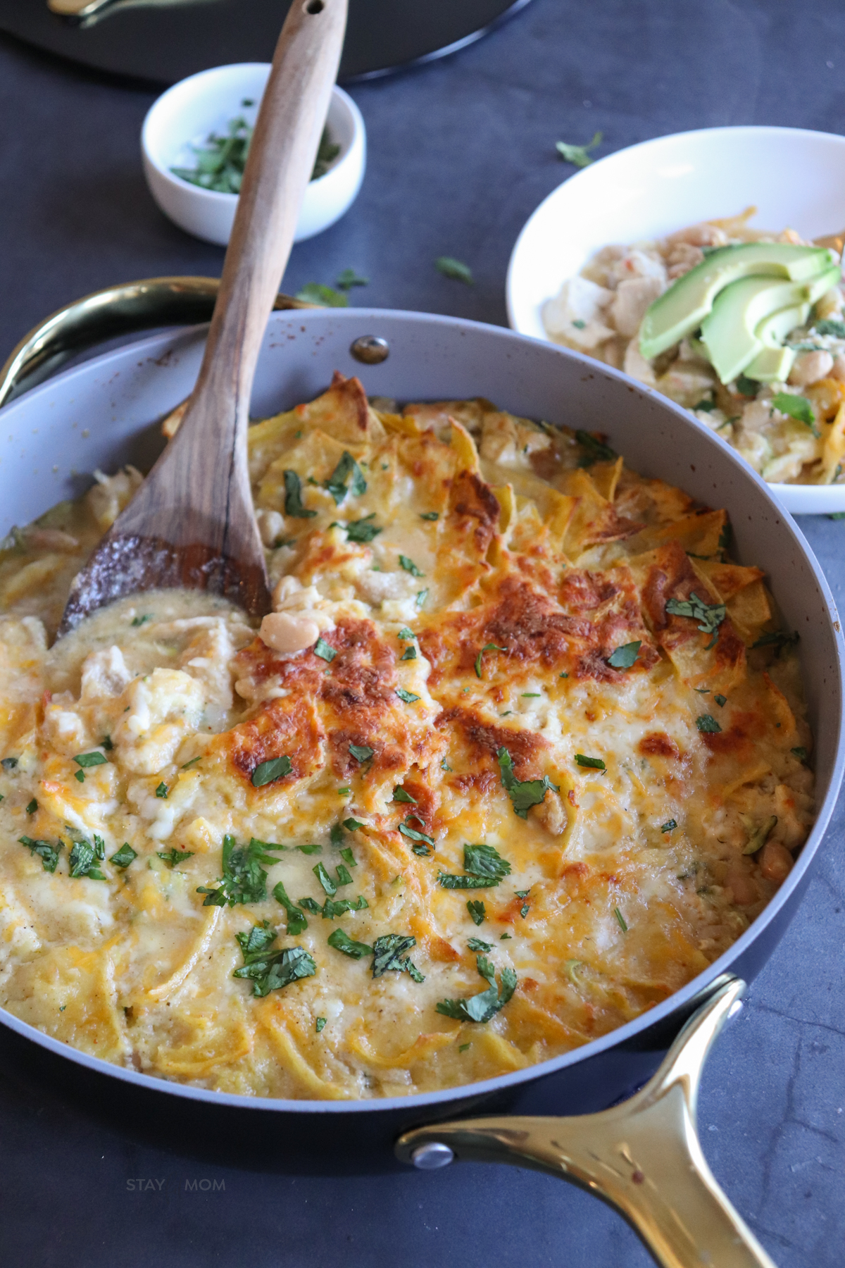 White Chicken Enchilada Skillet showing completed meal with visible white sauce chicken, beans, and melted mozzarella.