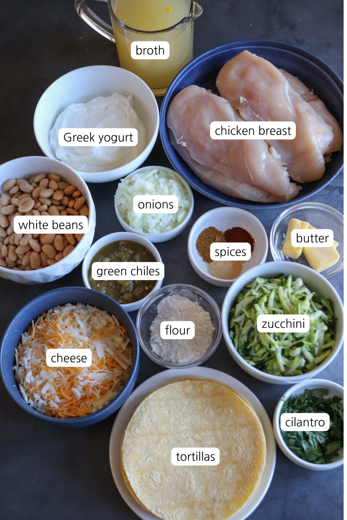 White Chicken Enchilada Skillet showing ingredients labeled in small bowls.