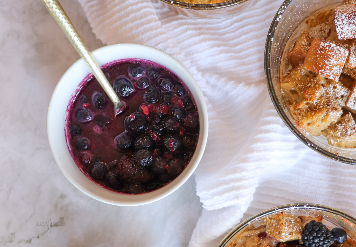 French Toast Bakes showing baked French Toast and berries on the side.