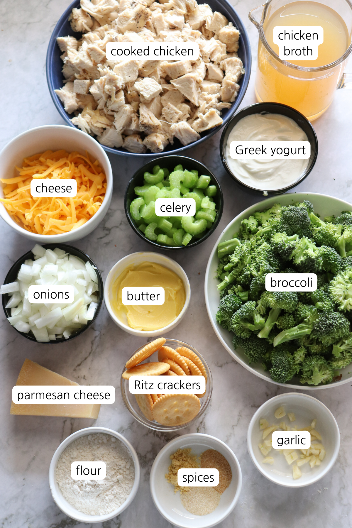 Chicken Divan showing ingredients labeled in small bowls and containers.