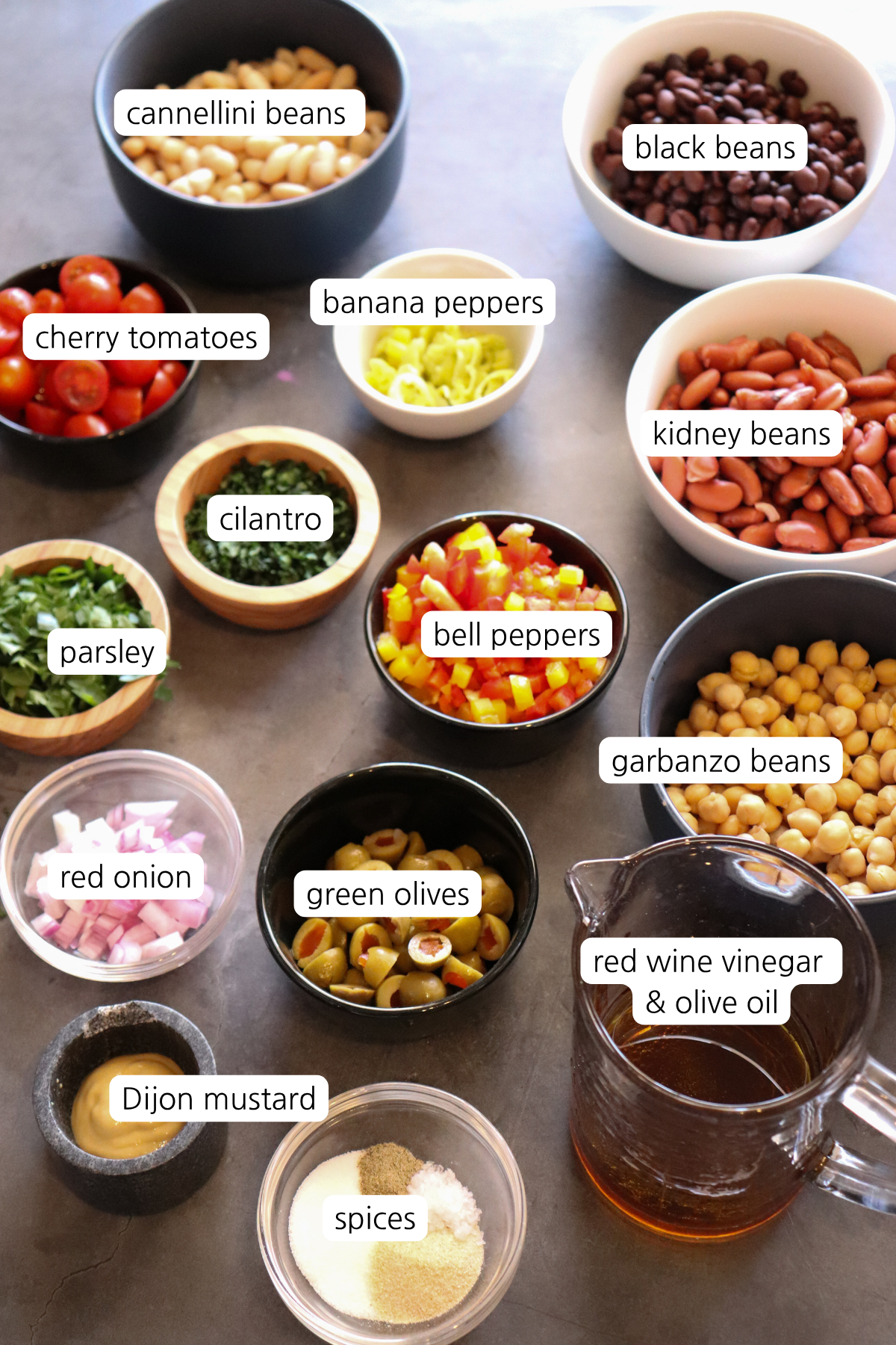 Bean Summer Salad showing ingredients labeled in small bowls.