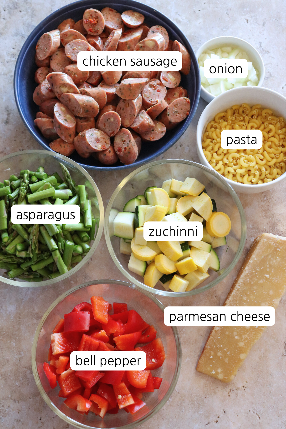 Veggie Mac & Chicken bowls showing ingredients in small bowls with labels.
