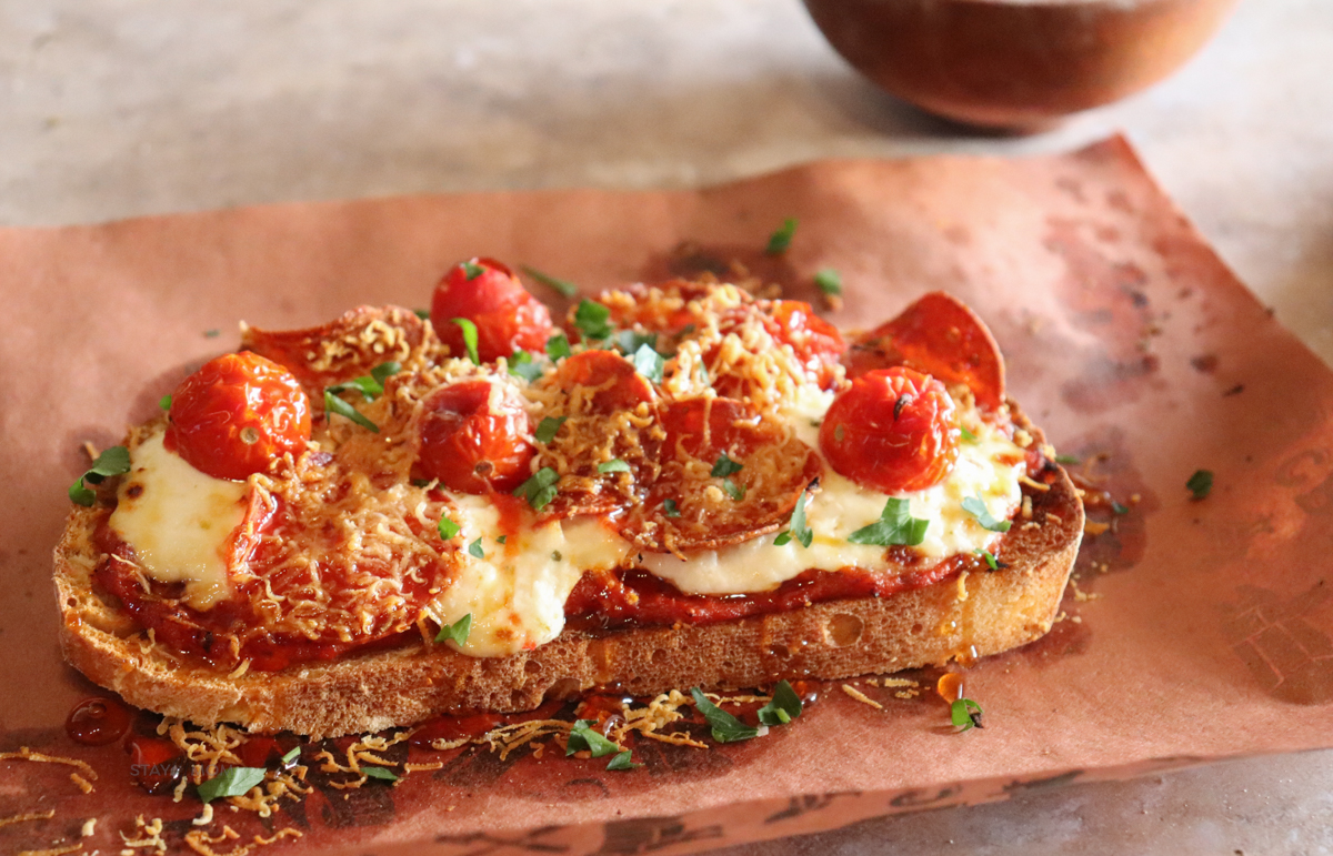 Sourdough Pizza Toast showing completed recipe with visible toasted sourdough, turkey pepperoni, melted cheese, and cherry tomatoes.