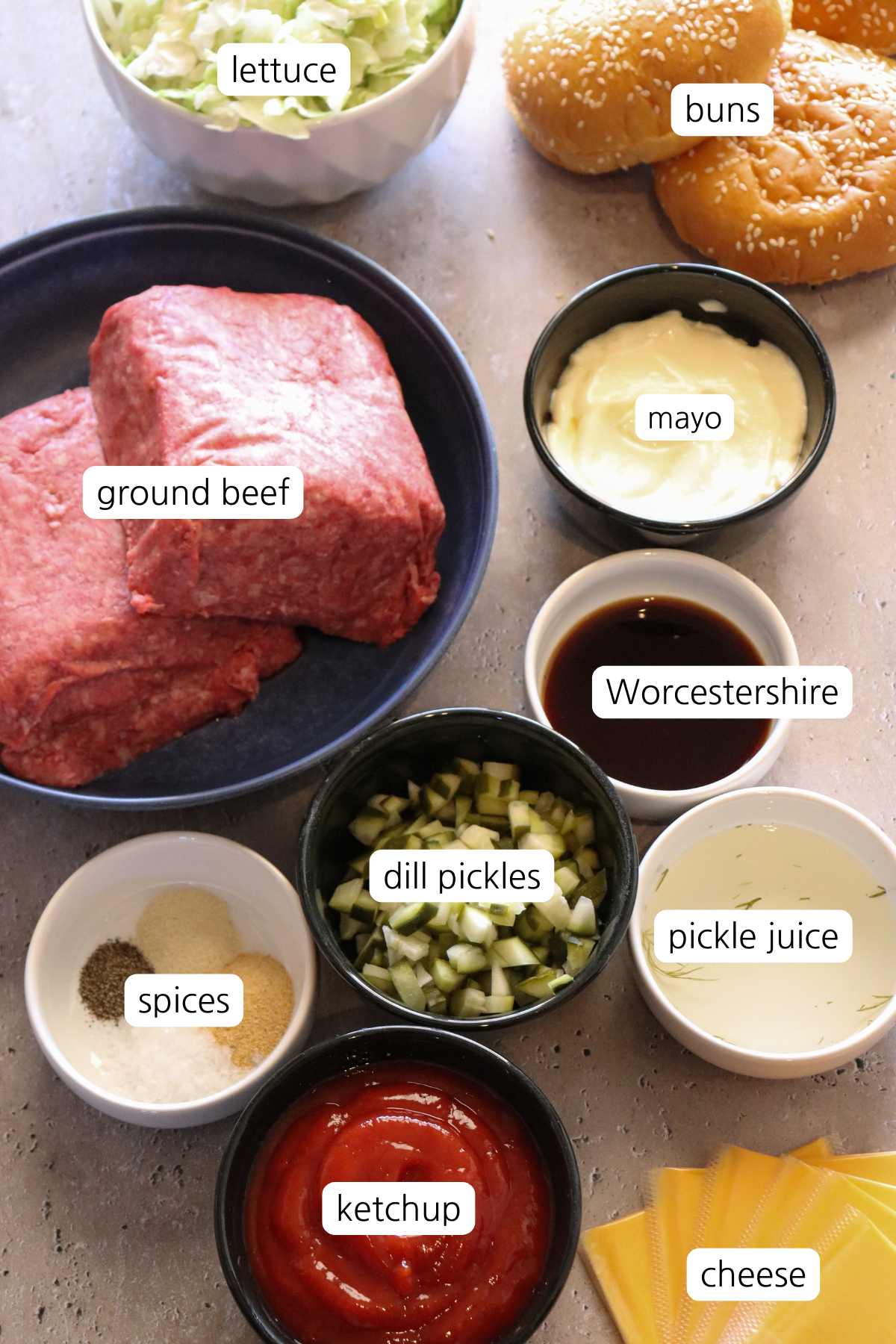 Cheeseburger Sloppy Joes showing ingredients labeled in small bowls.