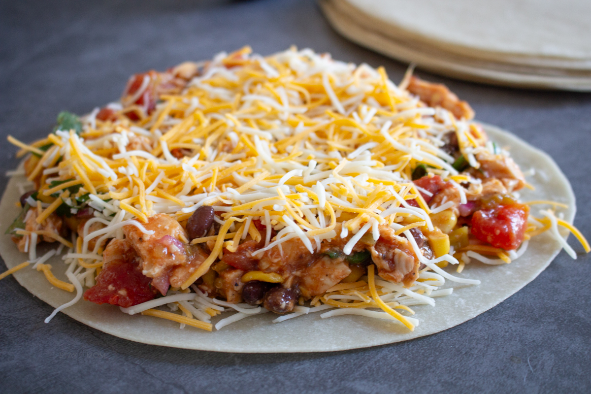 Cowboy Quesadillas showing raw tortilla topped with filling.
