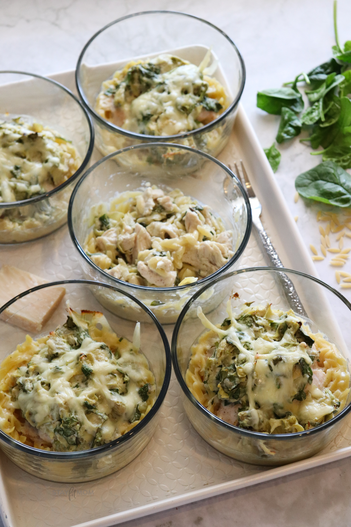 Spinach artichoke chicken orzo bakes.