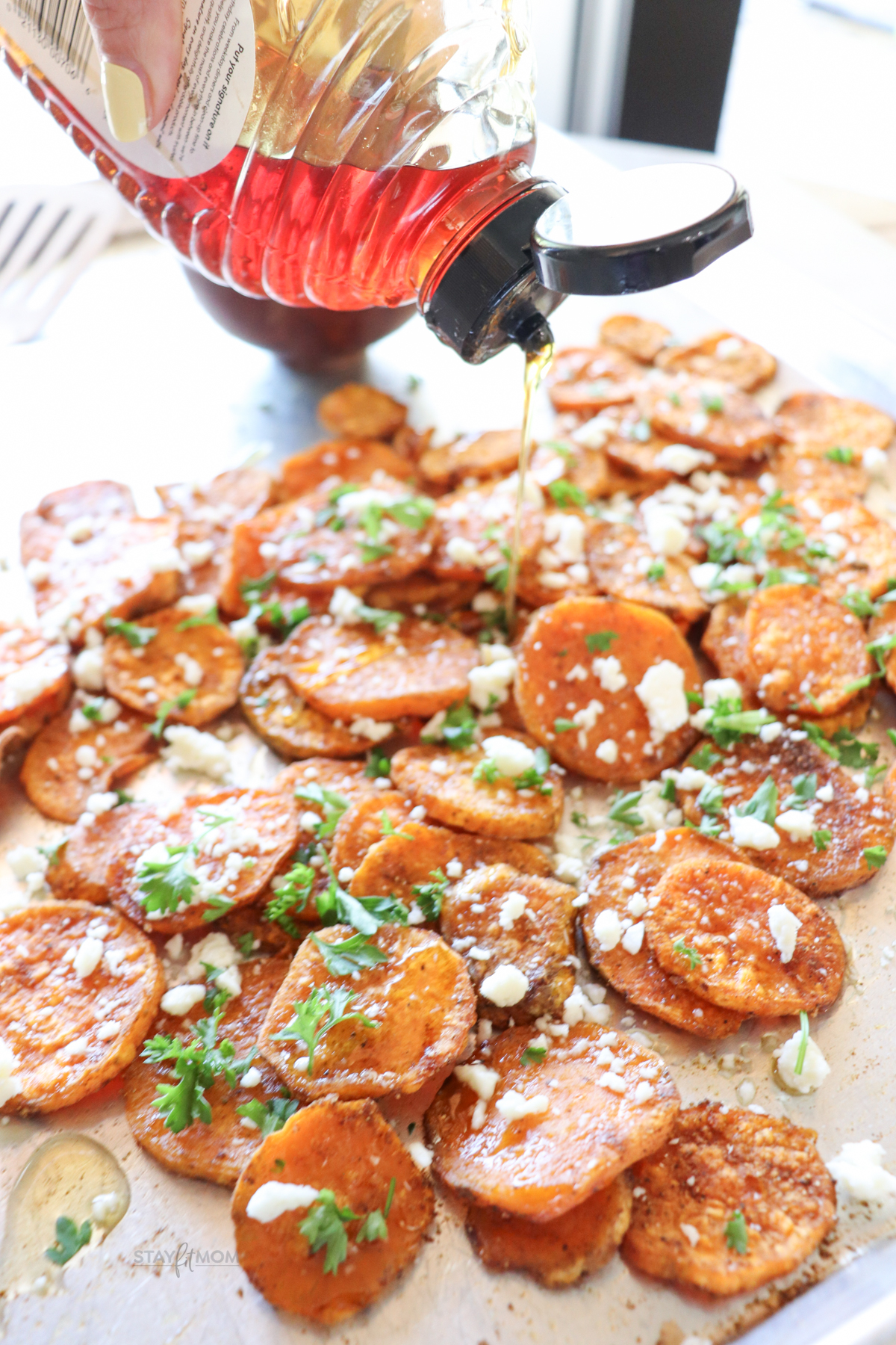 Honey roasted sweet potato rounds showing sweet potatoes roasted, topped with feta, and being drizzled with honey.