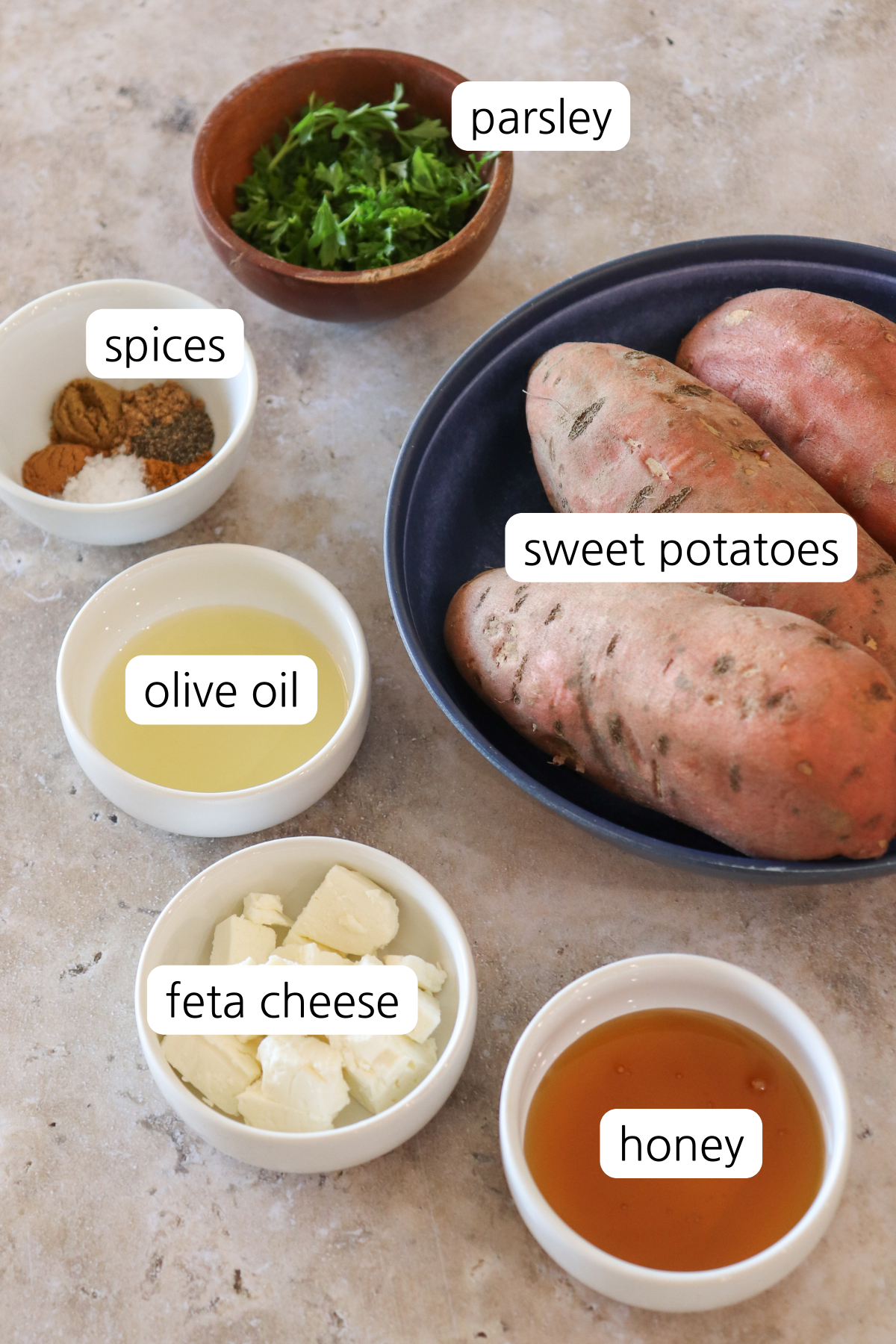 Honey roasted sweet potato rounds showing small bowls of labeled ingredients.