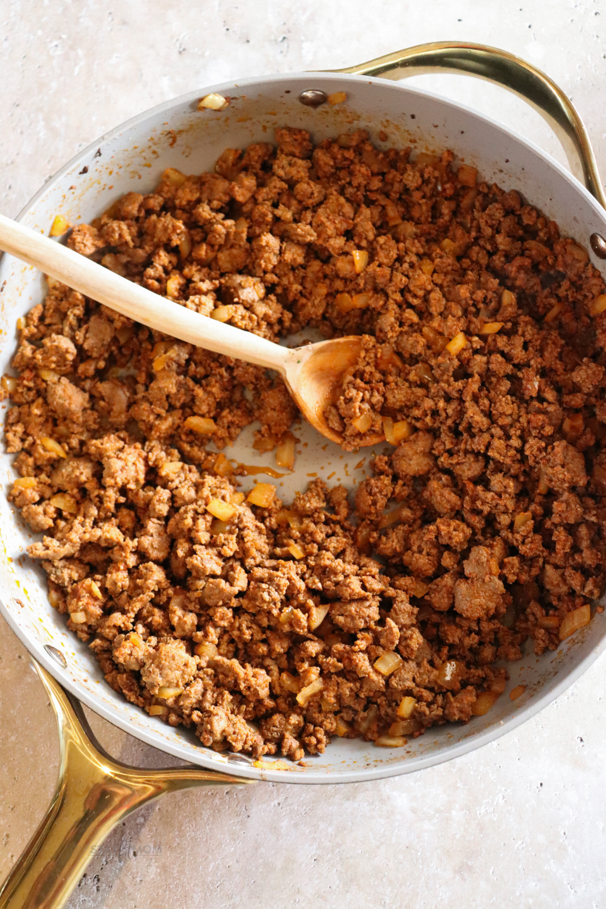 Ground beef cooked with diced onions and seasonings.