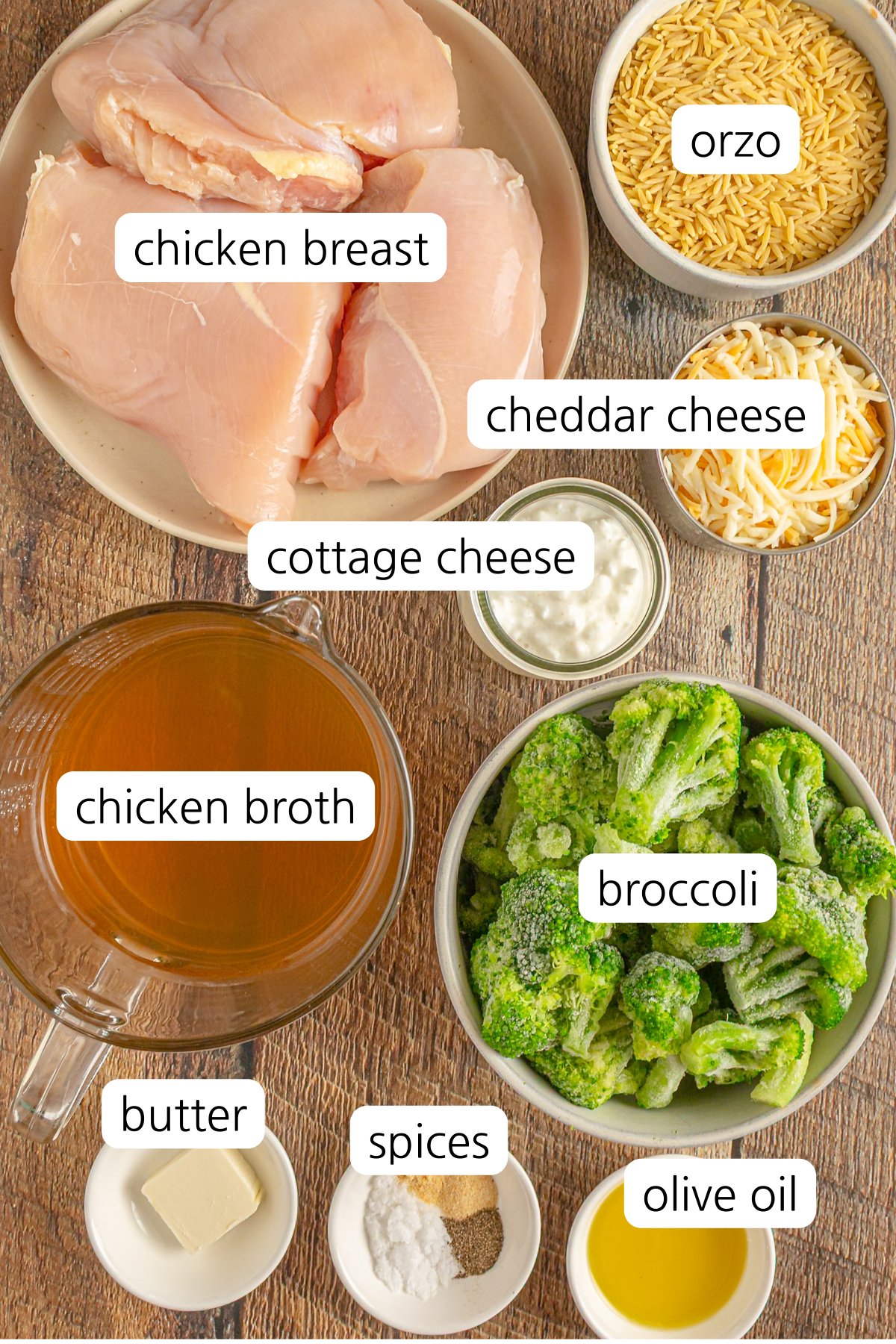 Broccoli cheddar chicken orzo showing ingredients labeled in small bowls.