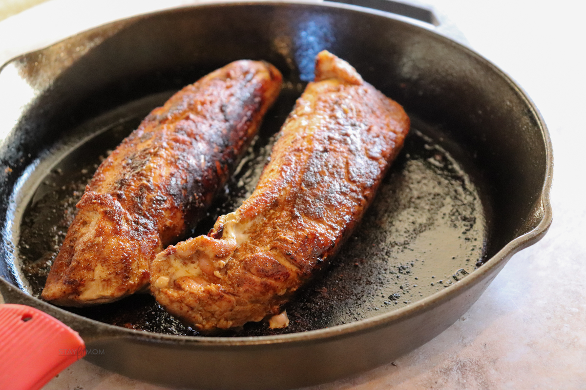 Pork tenderloin seared and baked in a cast iron skillet.