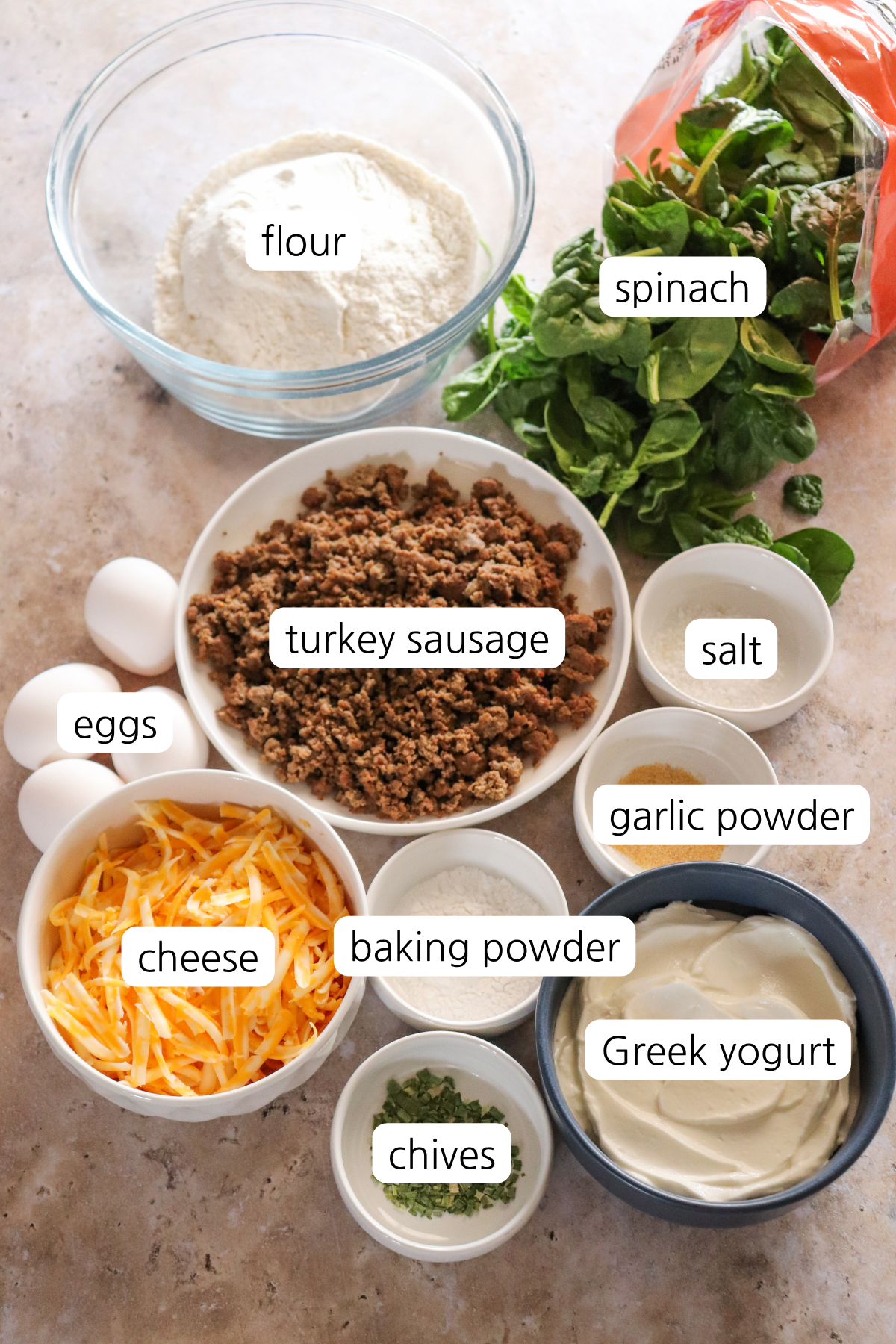 Cheesy Sausage Biscuits ingredients labeled in small bowls/containers.