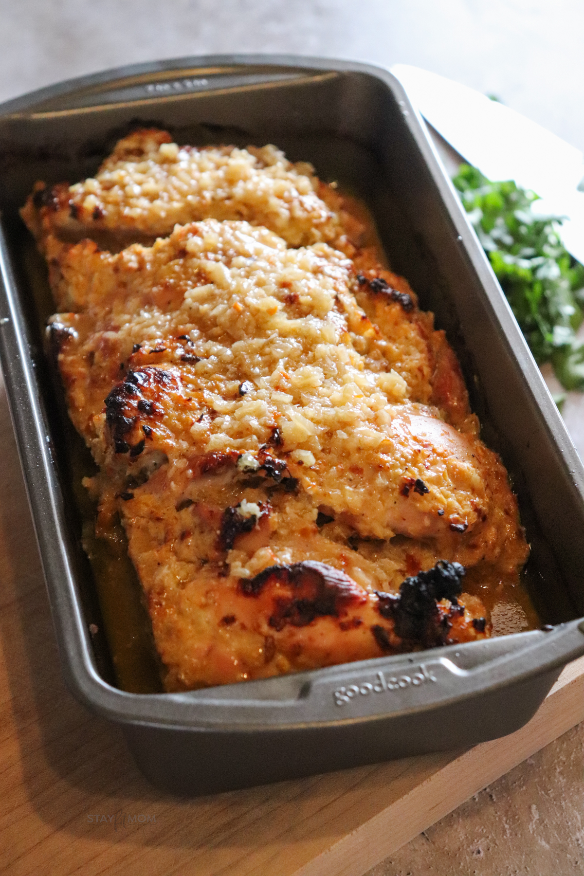 Crunchy onion loaf pan chicken showing finished recipe baked and in loaf pan.