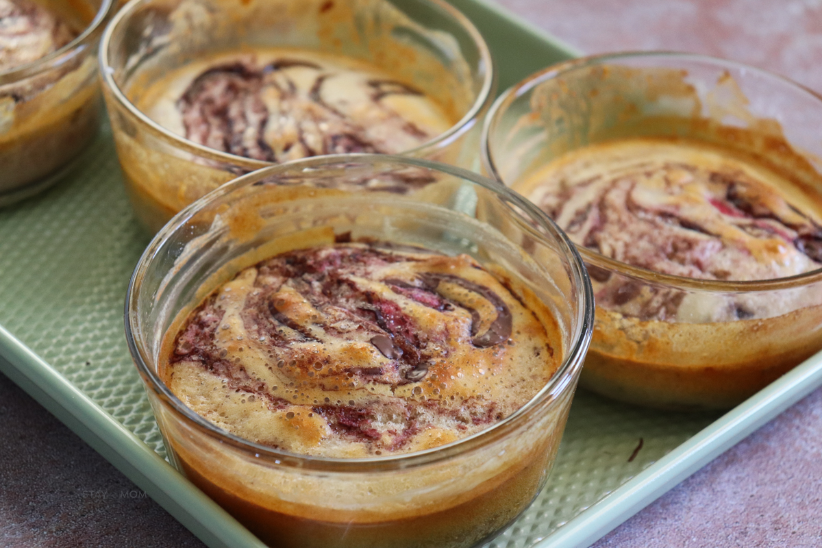Real Strawberry Nutella Protein Pancake Bowls showing finished recipe with pancake bowls swirled with strawberries and nutella.