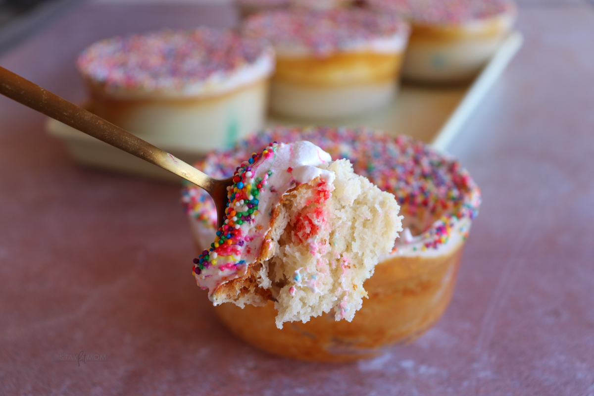 A completed Dot Pancake Bowl with a perfect bite on a spoon in front o the completed meal prep.