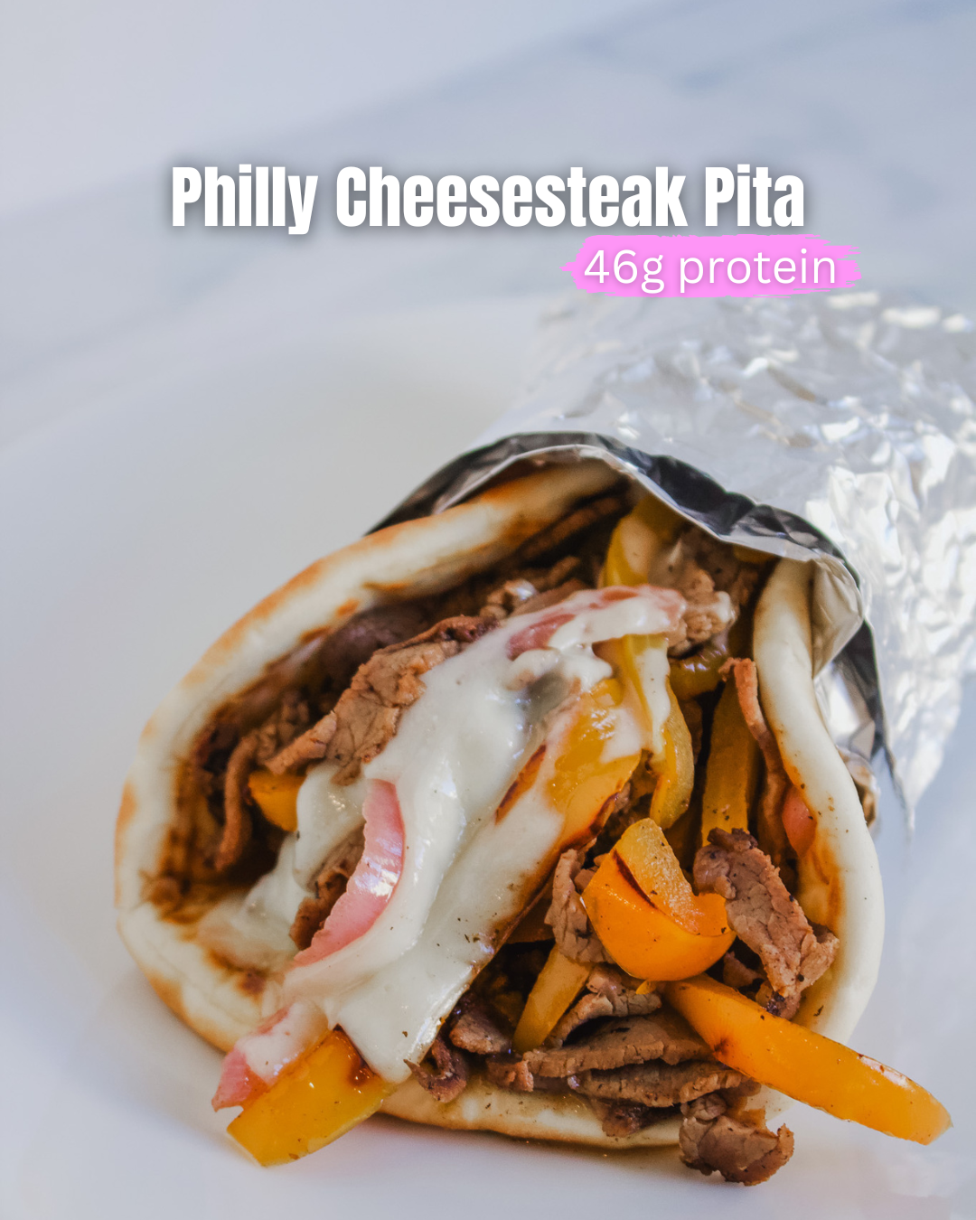 Philly Cheesesteak Pita showing completed meal with a pita rolled and filled with roast beef, peppers, onions, and cheese.