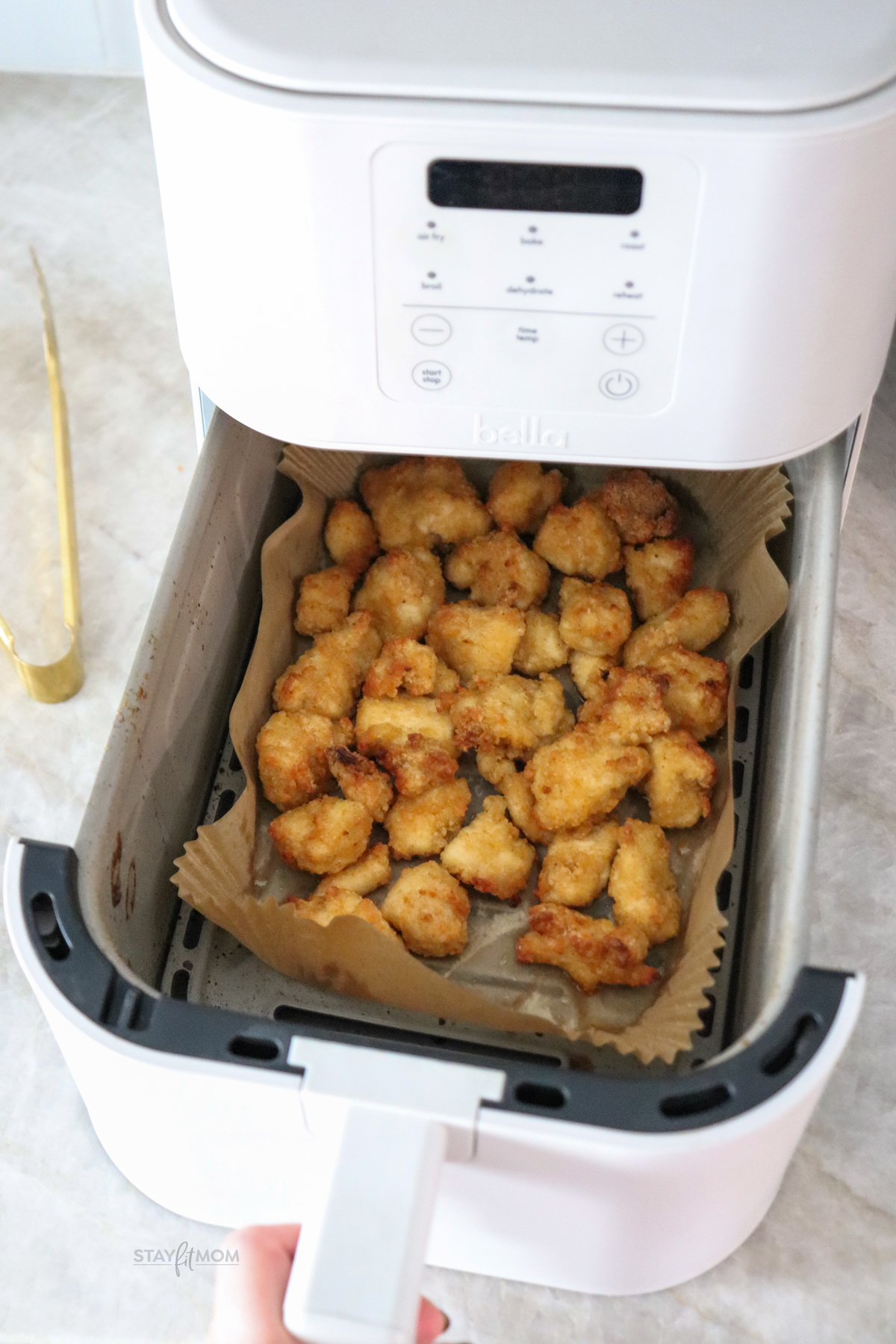 Air fryer full of cooked Bare nuggets.