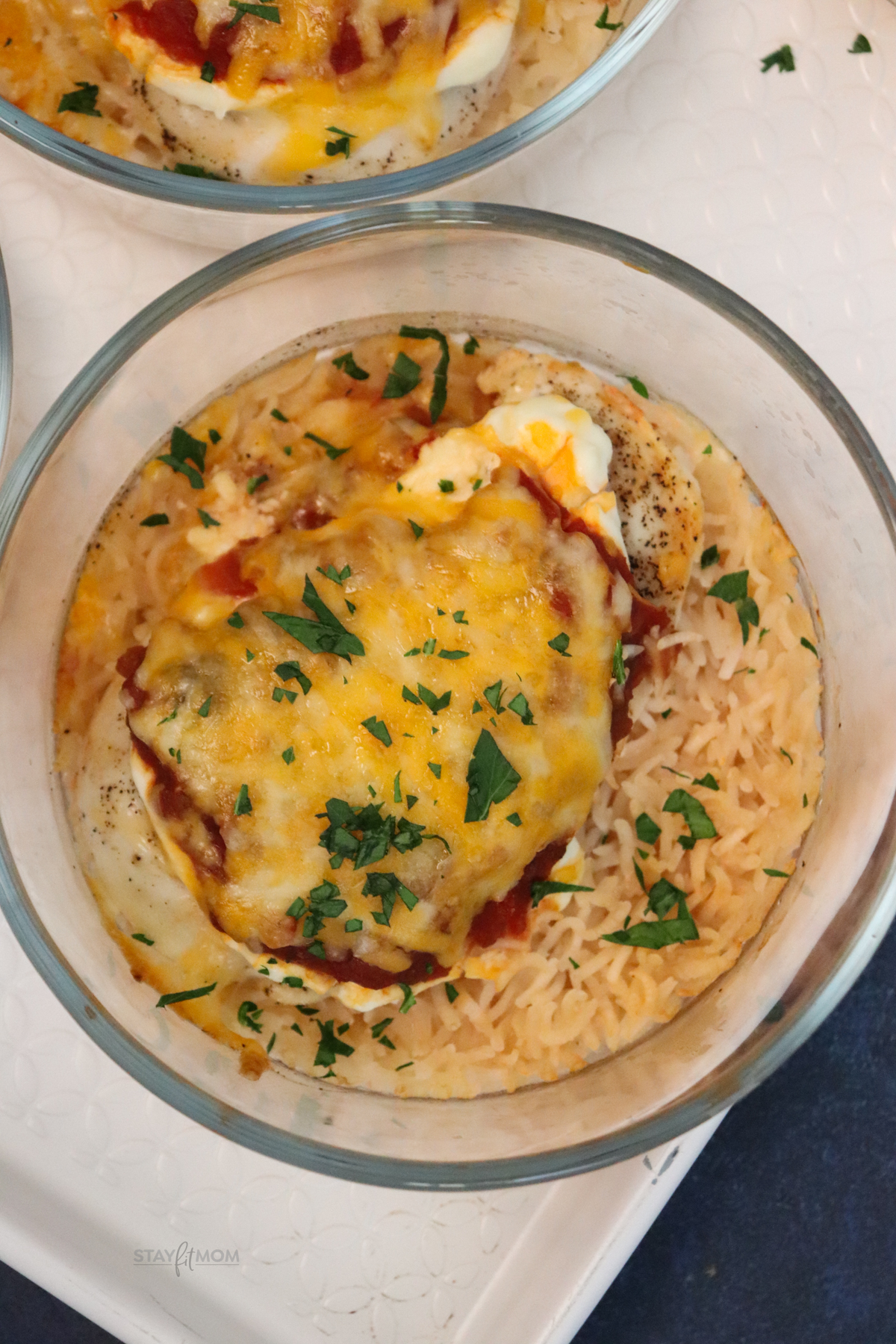 Top view of a Salsa Chicken Bake showing perfectly cooked rice with chicken toped with salsa, cream cheese, and shredded cheese all baked to perfection.