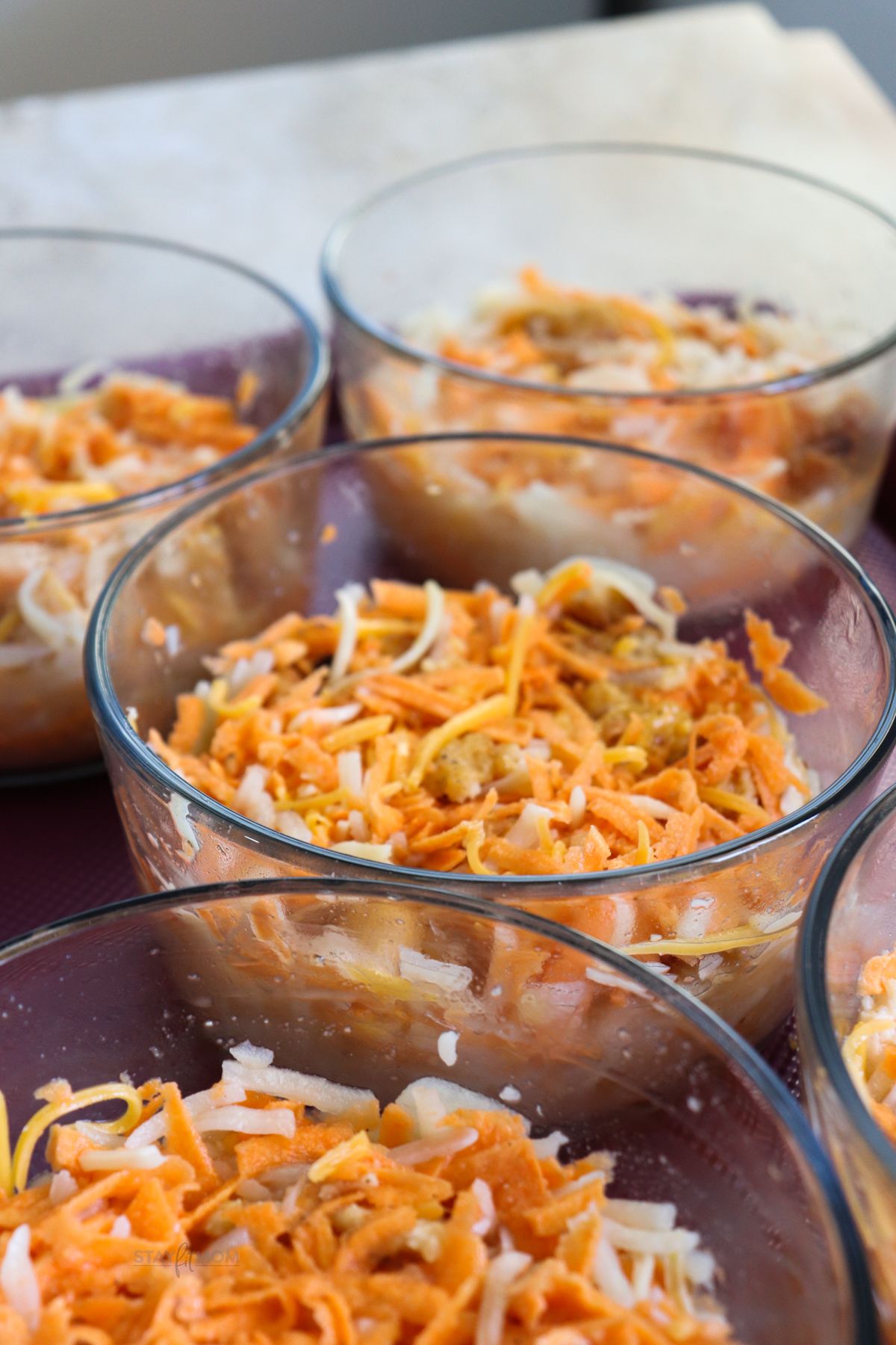 Chicken Chunk Scramble Bowls showing a close up image of the bowls filled and ready to be baked.