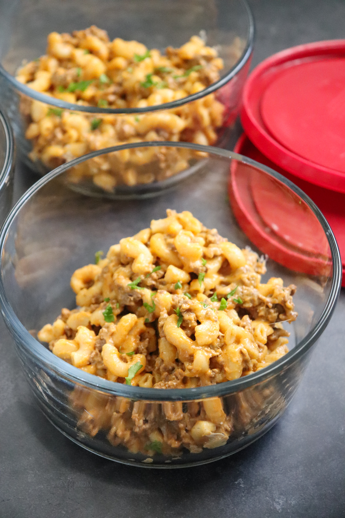 A single serve glass bowl with a serving of Hamburger Mac.