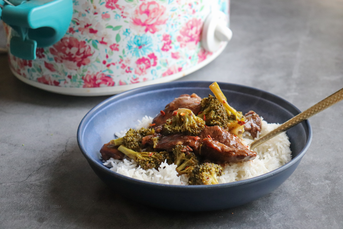 Beef & Broccoli showing completed recipe being served on a bed of rice.